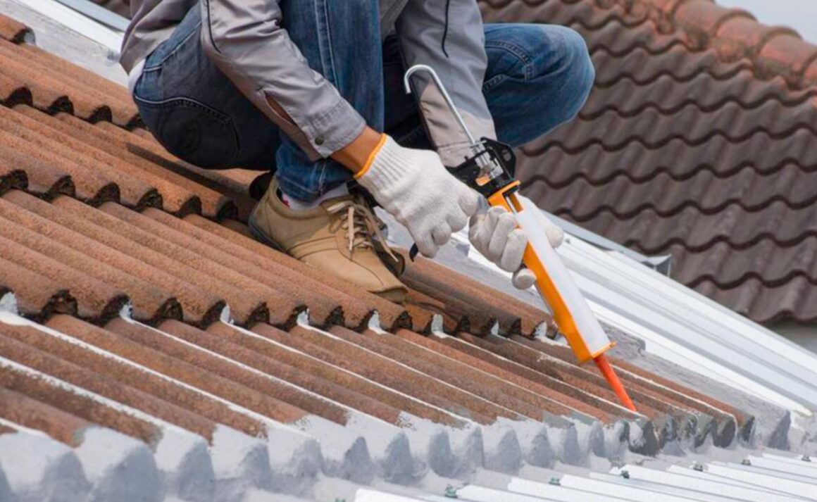 Worker Setting up a Roof. Roof Sealant Benefits